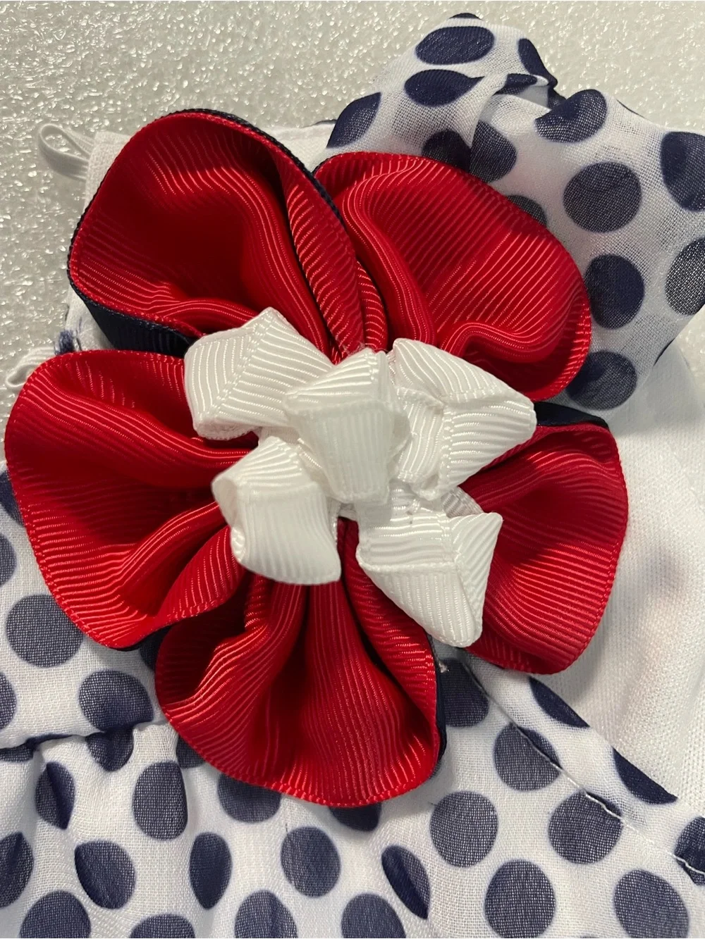 Rare Editions Gray Polka Dot Bib with Red Flower Accent